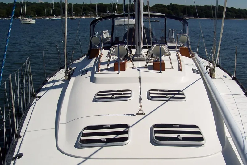 Slide: The Image of Sailing yacht C&C 51' XL / CB, 1994 model, docked in a serene harbor. - 5