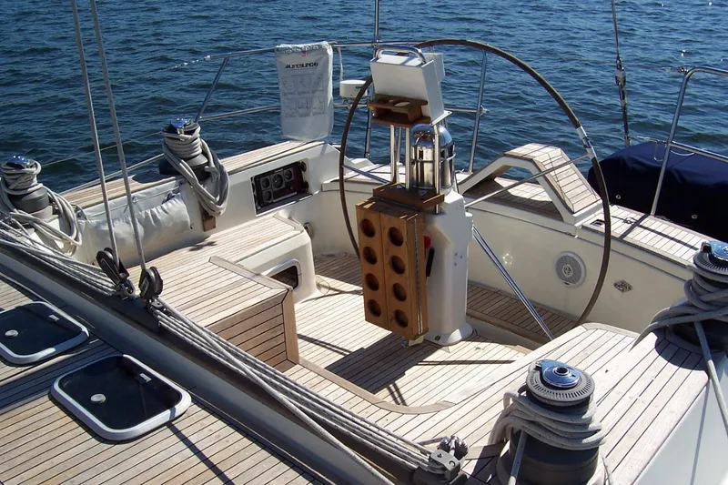 Slide: The Image of Cockpit of a 1994 C&C 51' XL / CB sailboat with wooden deck and steering wheel. - 9