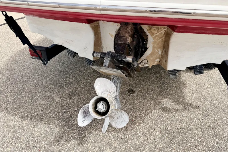 Slide: The Image of Rear view of a 2003 Sea Ray 200 Sundeck boat showing the propeller and stern drive. - 10