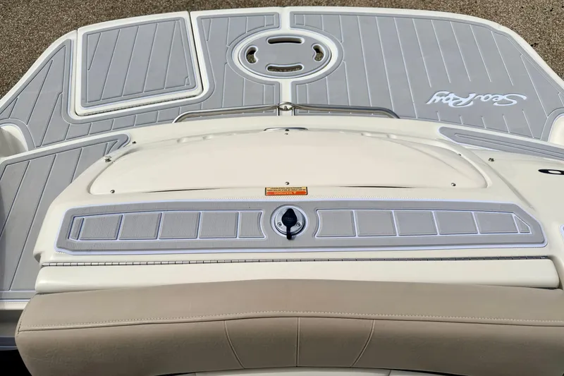 Slide: The Image of 2003 Sea Ray 200 Sundeck boat deck with gray and white detailing. - 16
