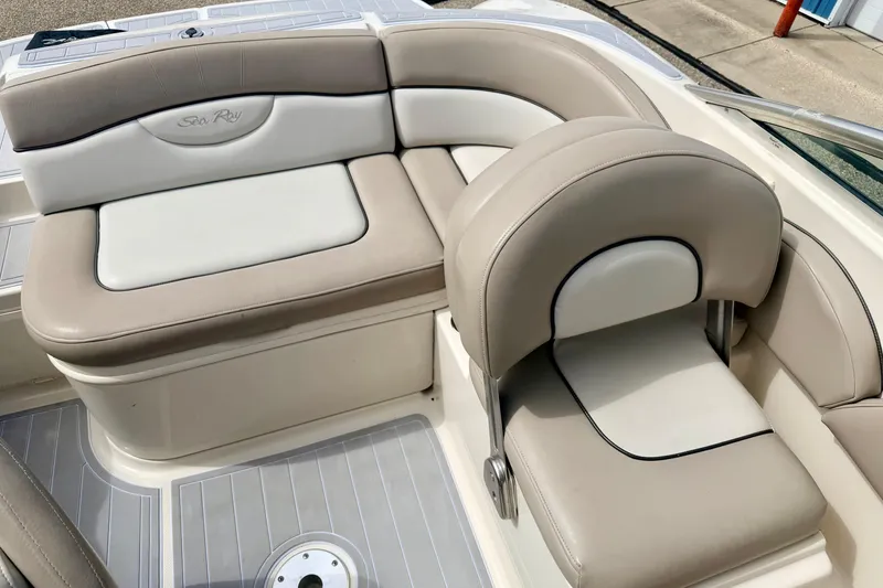 Slide: The Image of 2003 Sea Ray 200 Sundeck boat interior with beige and white seating. - 17