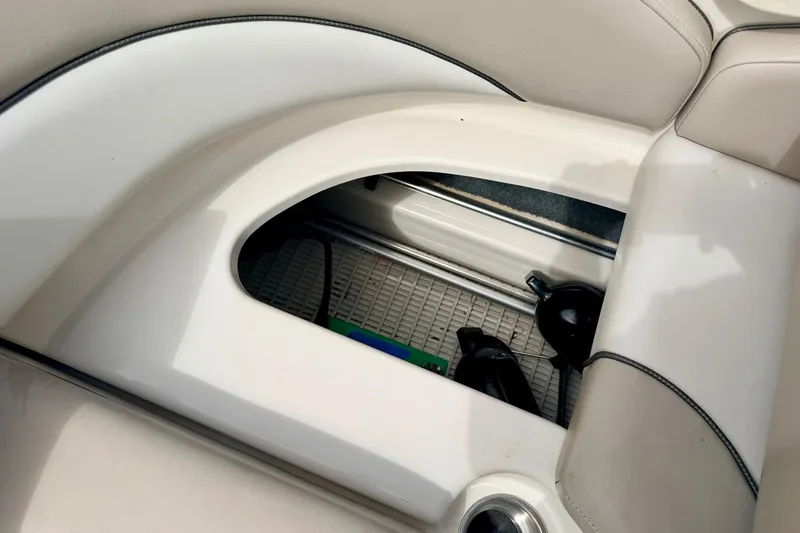 Slide: The Image of Storage compartment in a 2003 Sea Ray 200 Sundeck boat interior. - 22