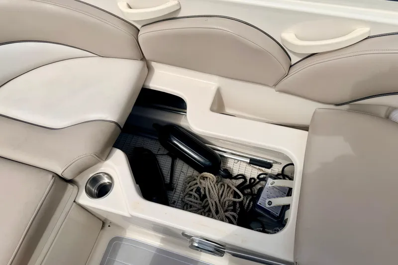 Slide: The Image of Storage compartment on a 2003 Sea Ray 200 Sundeck boat with ropes and accessories. - 25