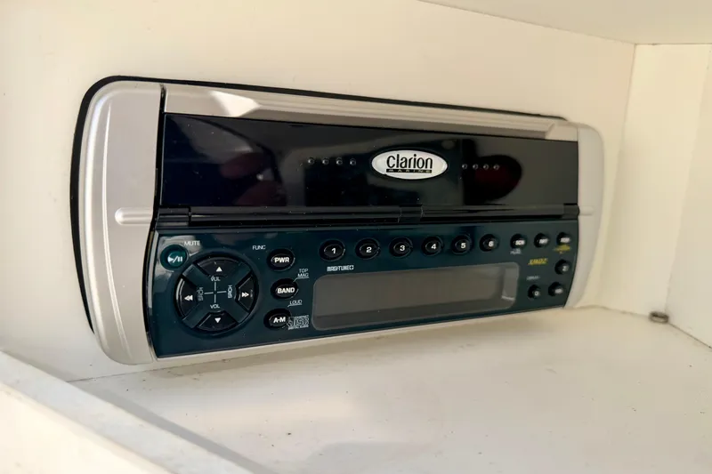 Slide: The Image of Clarion stereo system in a 2003 Sea Ray 200 Sundeck boat interior. - 38