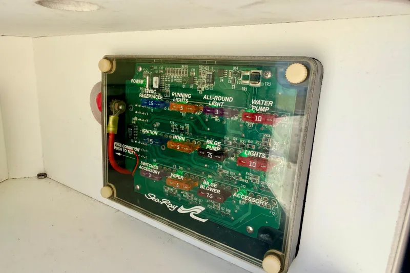 Slide: The Image of Electrical fuse panel of a 2003 Sea Ray 200 Sundeck boat. - 39