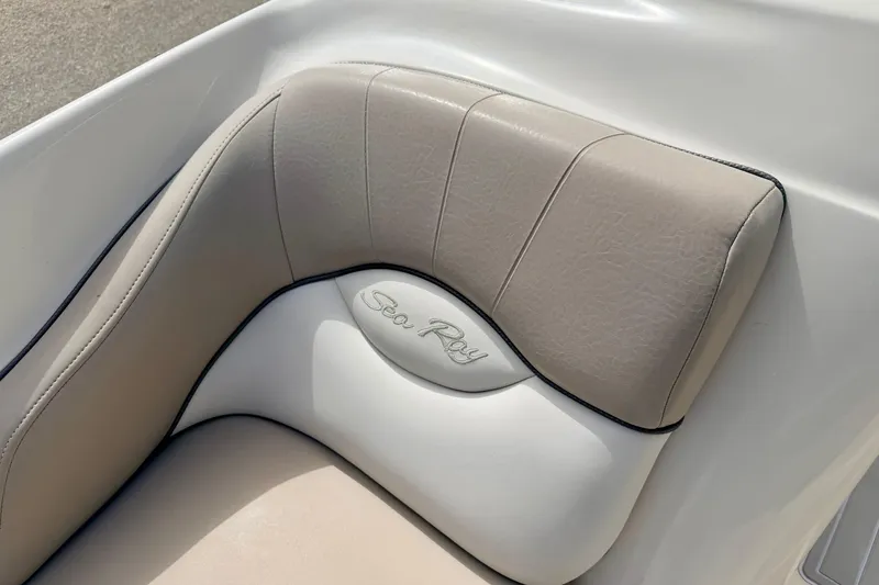 Slide: The Image of Close-up of 2003 Sea Ray 200 Sundeck boat seat with logo. - 46