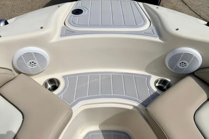 Slide: The Image of Interior of 2003 Sea Ray 200 Sundeck boat with speakers and cup holders. - 52