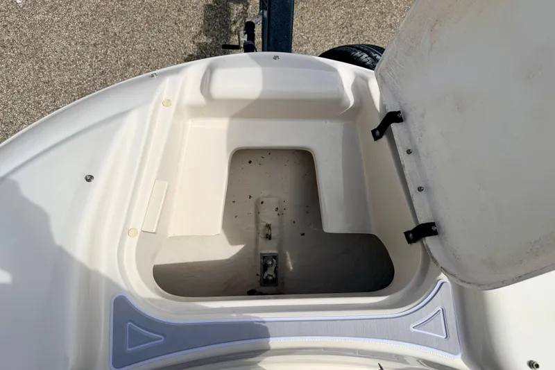 Slide: The Image of Open storage compartment on a 2003 Sea Ray 200 Sundeck boat. - 53