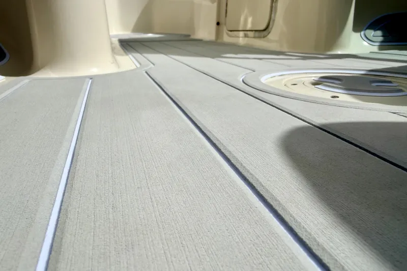 Slide: The Image of Close-up of 2003 Sea Ray 200 Sundeck boat deck with textured surface. - 59