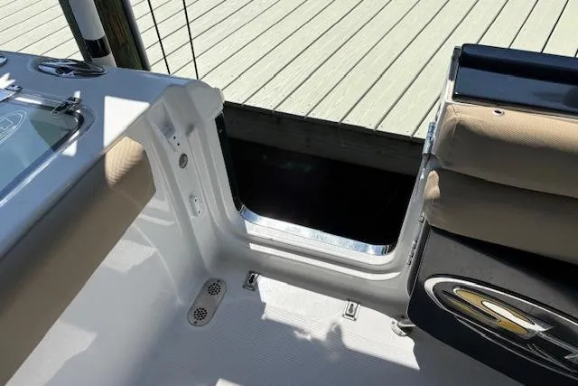 Slide: The Image of 2017 Sea Hunt Gamefish 25 boat interior with seating and deck details. - 14