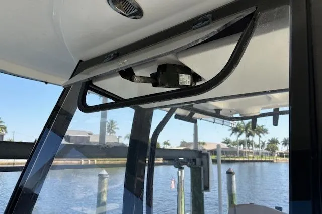 Slide: The Image of 2017 Sea Hunt Gamefish 25 boat interior with water view and dock in background. - 16