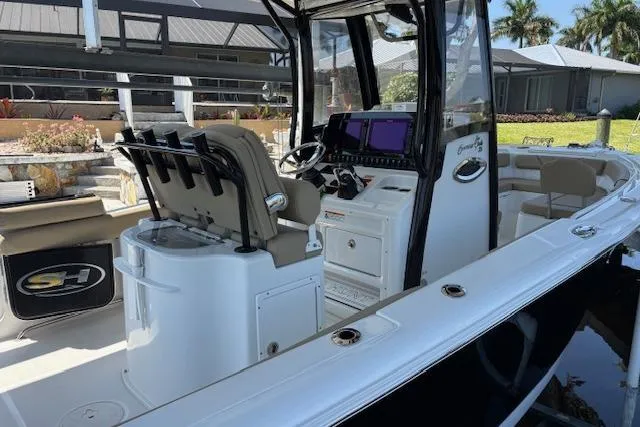Slide: The Image of 2017 Sea Hunt Gamefish 25 boat interior with modern console and seating. - 6
