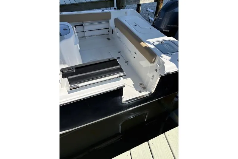 Slide: The Image of 2017 Sea Hunt Gamefish 25 boat interior with seating and storage compartments. - 8