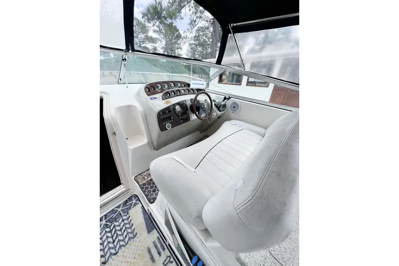 Slide: The Image of Cockpit of 2000 Rinker Fiesta Vee 330 with steering wheel and instrument panel. - 13