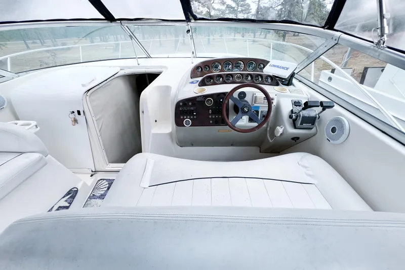 Slide: The Image of Cockpit of 2000 Rinker Fiesta Vee 330 boat with steering wheel and control panel. - 14