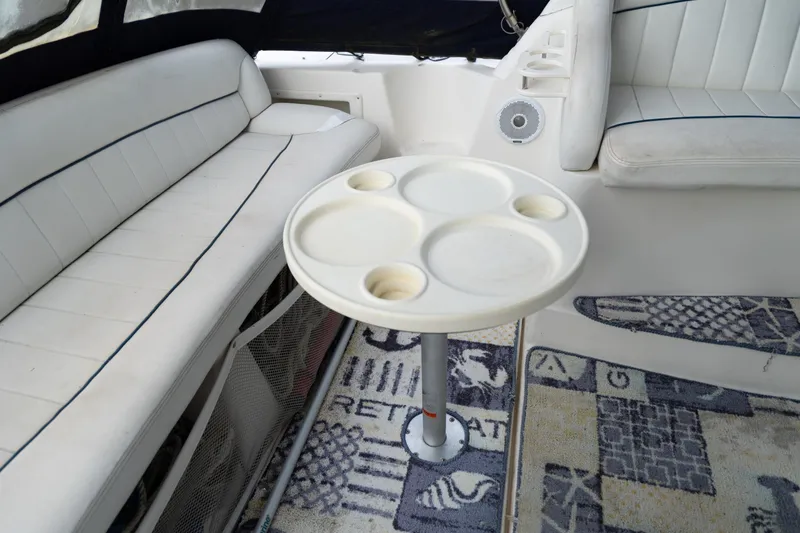 Slide: The Image of Interior of 2000 Rinker Fiesta Vee 330 with seating and round table. - 3