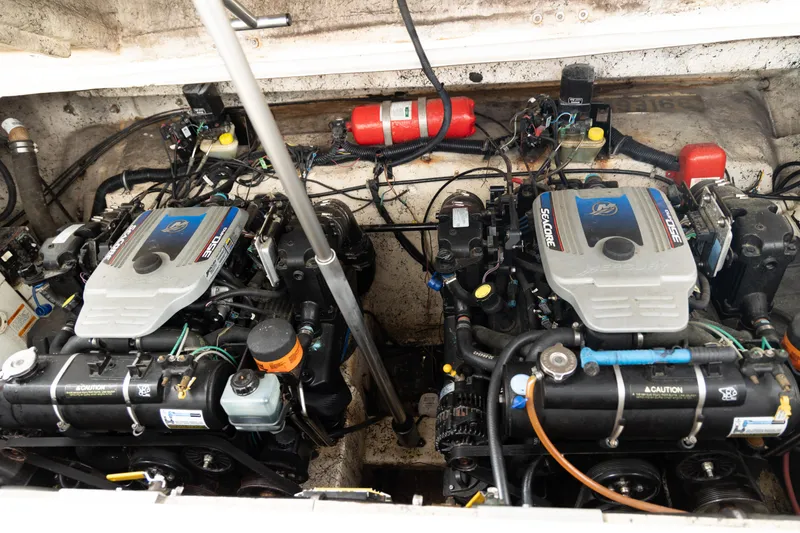 Slide: The Image of Twin engines in a 2000 Rinker Fiesta Vee 330 boat, showcasing detailed mechanical components. - 4