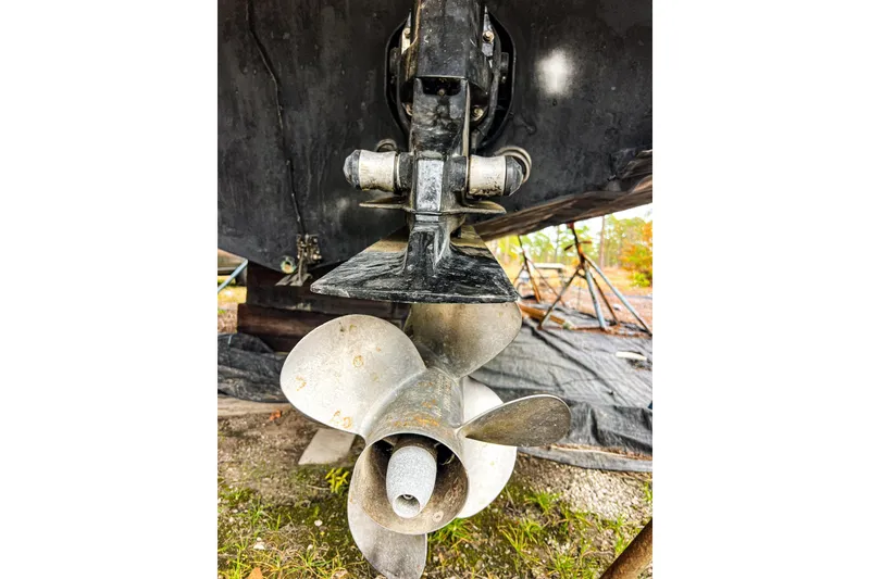 Slide: The Image of Propeller of 2000 Rinker Fiesta Vee 330 boat on dry land. - 5