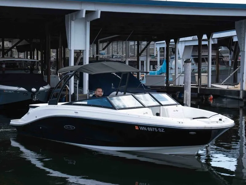The Image of 2022 Sea Ray SPX 230 boat docked, sleek and modern. - 1