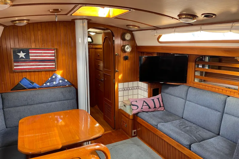 Slide: The Image of Navigation station of a 1985 Passport 470 Center Cockpit yacht with control panels and equipment. - 10