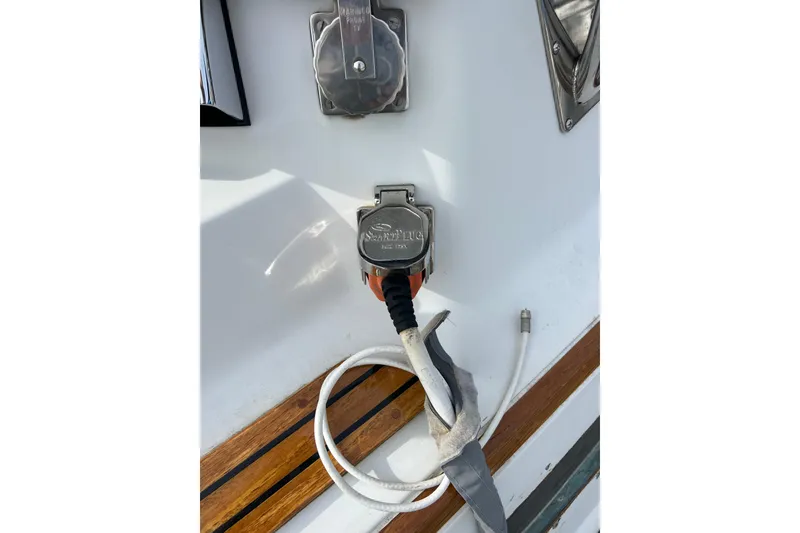 Slide: The Image of Power connection on 1985 Passport 470 Center Cockpit sailboat deck. - 28