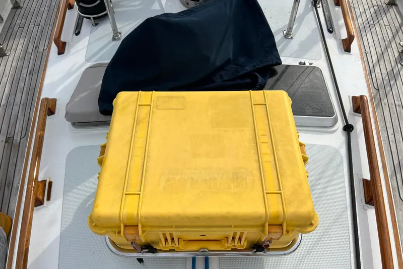 Slide: The Image of Yellow storage case on 1985 Passport 470 Center Cockpit deck. - 35