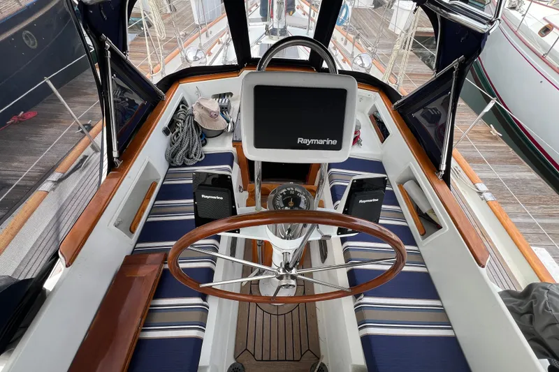Slide: The Image of Cockpit of 1985 Passport 470 Center Cockpit sailboat with Raymarine navigation system. - 36