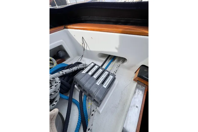 Slide: The Image of Control panel and ropes on a 1985 Passport 470 Center Cockpit sailboat. - 40