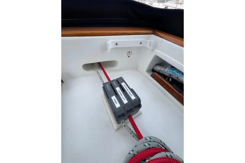 Slide: The Image of Cockpit of 1985 Passport 470 Center Cockpit sailboat with labeled rope clutches. - 41