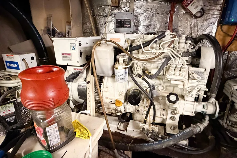 Slide: The Image of Engine room of a 1989 Jefferson Marquessa 52 Extended Deckhouse yacht, showcasing machinery and components. - 117