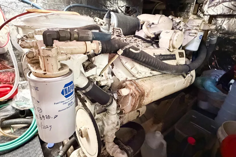 Slide: The Image of Engine room of 1989 Jefferson Marquessa 52 with Caterpillar engine and NAPA fuel filter. - 118