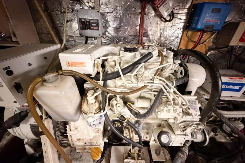 Slide: The Image of Engine room of 1989 Jefferson Marquessa 52 Extended Deckhouse with visible machinery and wiring. - 119