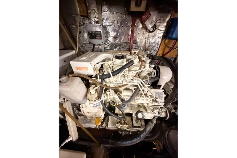Slide: The Image of Engine room of 1989 Jefferson Marquessa 52 Extended Deckhouse with visible machinery and wiring. - 120