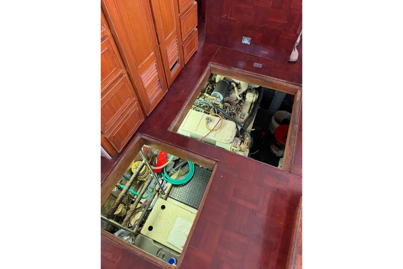 Slide: The Image of Engine room of 1989 Jefferson Marquessa 52 Extended Deckhouse with open floor panels. - 121