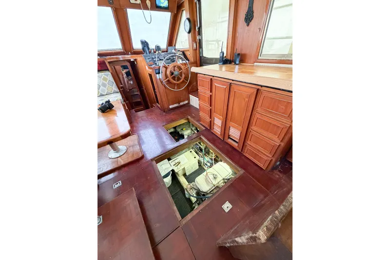 Slide: The Image of 1989 Jefferson Marquessa 52 yacht interior with wooden cabinetry and open engine access. - 122