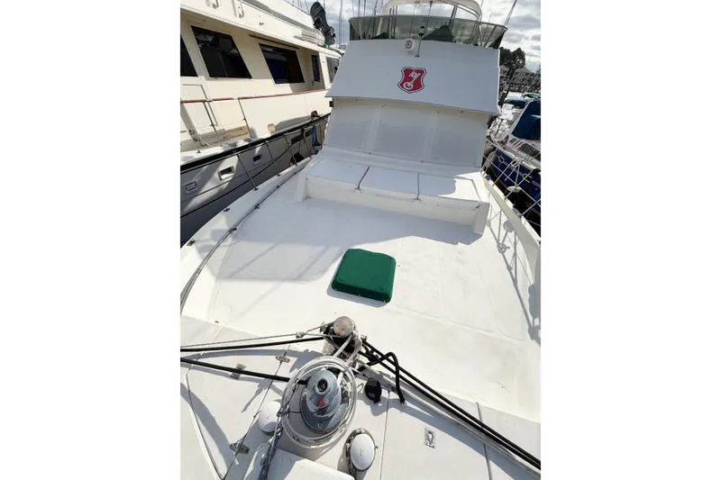 Slide: The Image of 1989 Jefferson Marquessa 52 Extended Deckhouse yacht docked at marina. - 13