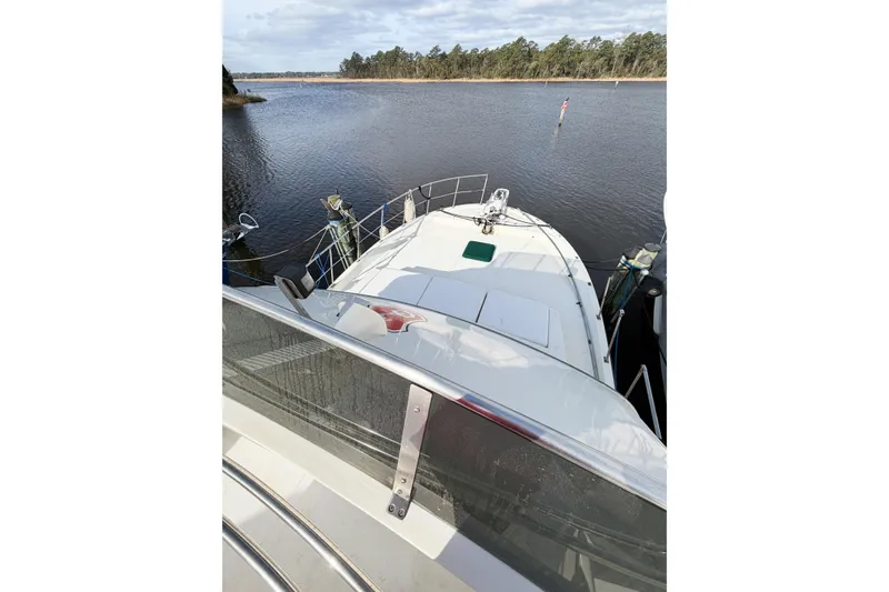 Slide: The Image of 1989 Jefferson Marquessa 52 yacht on serene water, viewed from deckhouse. - 29
