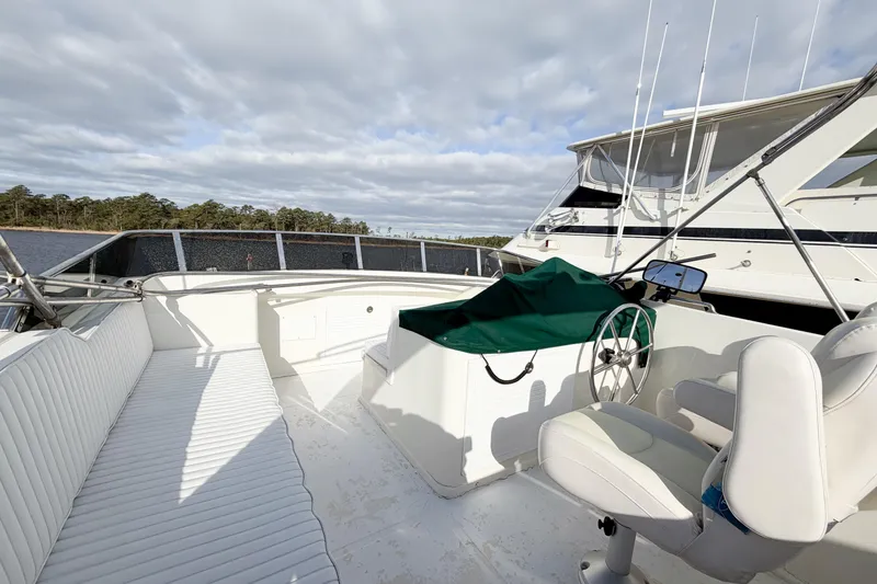 Slide: The Image of 1989 Jefferson Marquessa 52 Extended Deckhouse yacht deck with seating and steering wheel. - 35