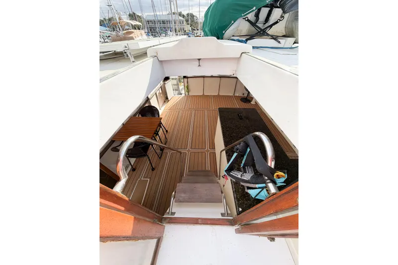Slide: The Image of 1989 Jefferson Marquessa 52 Extended Deckhouse interior with wooden flooring and seating area. - 36