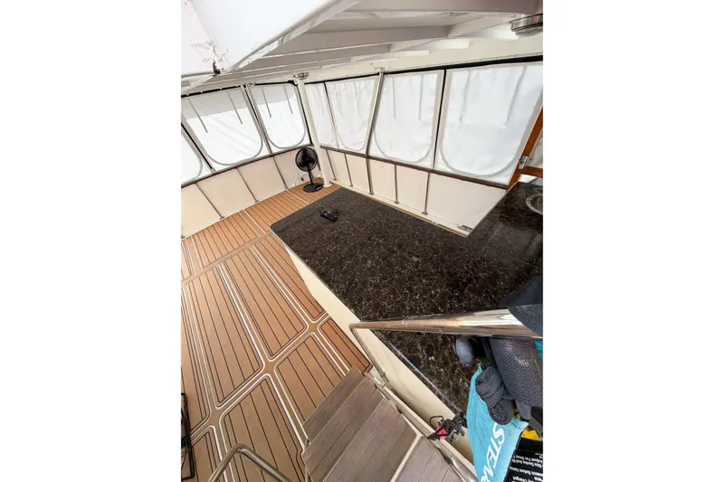 Slide: The Image of 1989 Jefferson Marquessa 52 yacht interior with wood flooring and granite countertop. - 37