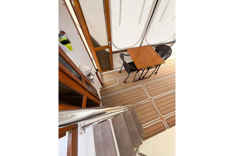 Slide: The Image of 1989 Jefferson Marquessa 52 yacht deck with wooden table and chairs. - 38