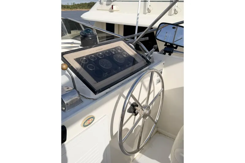 Slide: The Image of 1989 Jefferson Marquessa 52 yacht helm with steering wheel and instrument panel. - 44