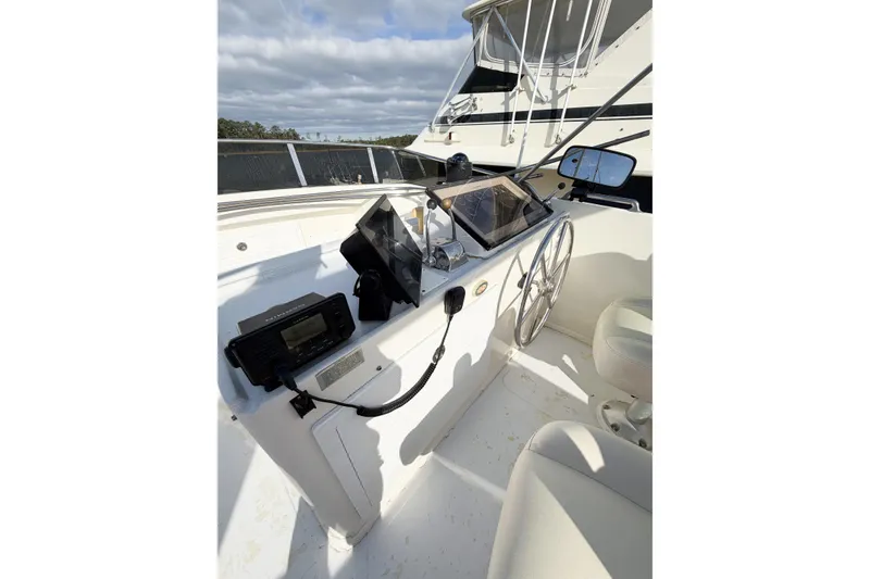 Slide: The Image of Helm of 1989 Jefferson Marquessa 52 Extended Deckhouse with steering wheel and navigation equipment. - 45