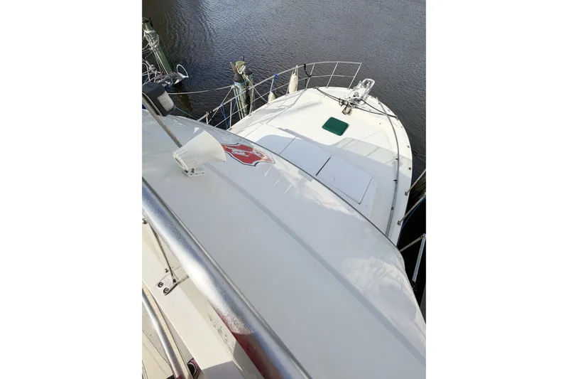 Slide: The Image of 1989 Jefferson Marquessa 52 Extended Deckhouse yacht docked, viewed from above. - 46