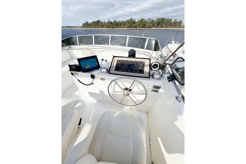 Slide: The Image of Cockpit of 1989 Jefferson Marquessa 52 yacht with navigation equipment and steering wheel. - 53
