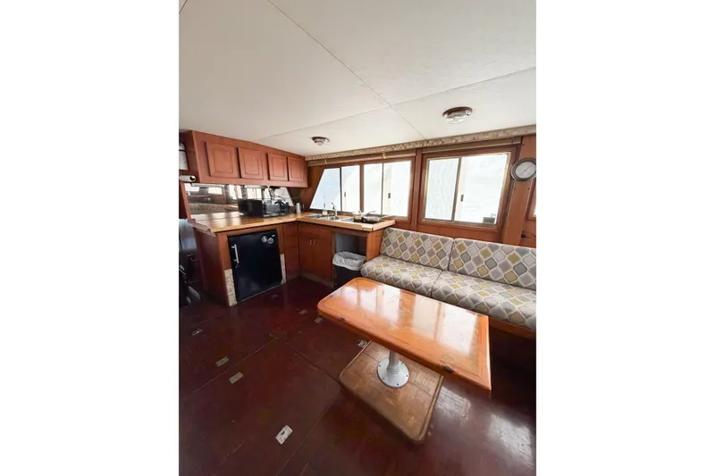 Slide: The Image of Interior of 1989 Jefferson Marquessa 52 yacht with kitchen and seating area. - 63