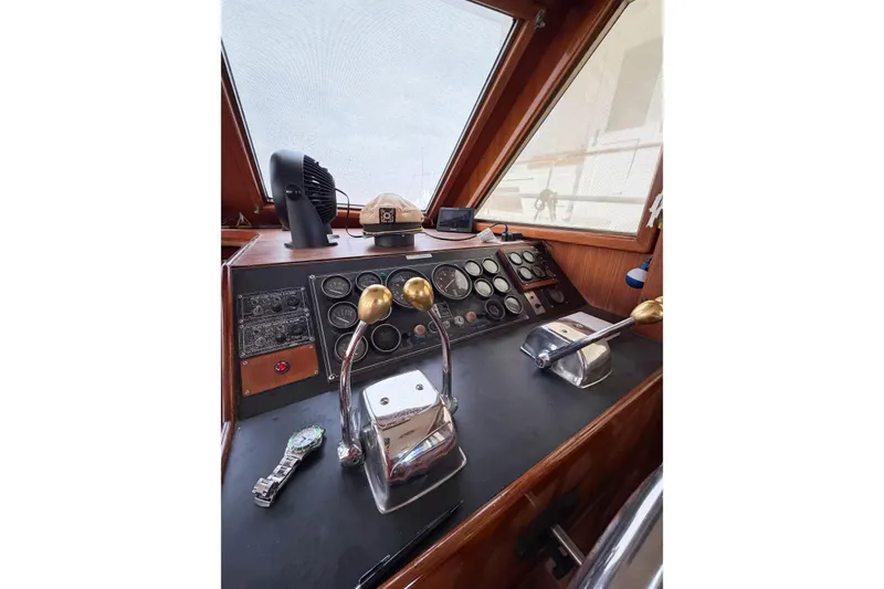 Slide: The Image of Cockpit of 1989 Jefferson Marquessa 52 Extended Deckhouse with control levers and gauges. - 66