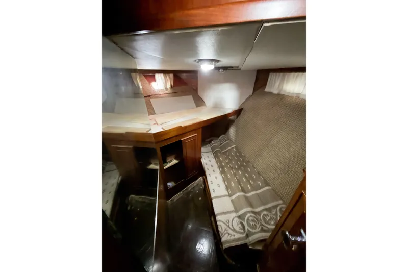 Slide: The Image of Interior cabin of 1989 Jefferson Marquessa 52 Extended Deckhouse yacht, featuring cozy bedding. - 75