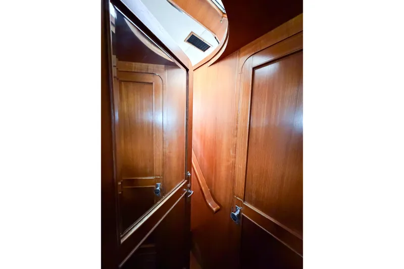 Slide: The Image of Interior view of 1989 Jefferson Marquessa 52 yacht with wooden paneling and doors. - 79