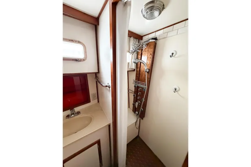 Slide: The Image of Bathroom interior of 1989 Jefferson Marquessa 52 yacht, featuring sink and shower. - 82